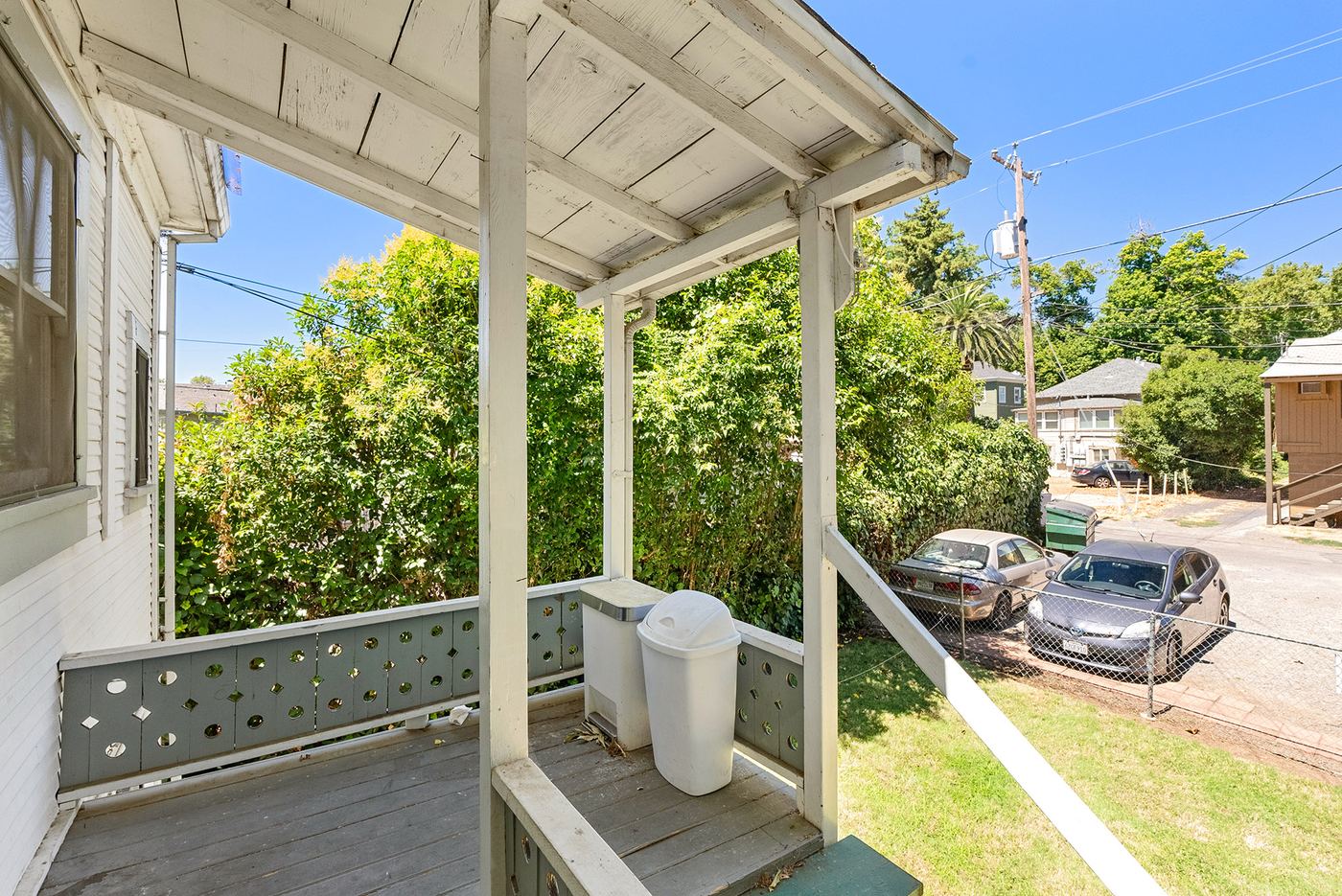 Unit 3 private covered porch overlooking the backyard